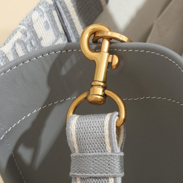 a1720369072658_6686 This book tote handbag was designed by Maria Grazia Chiuri, Creative Director of Dior Women's Wear