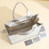 a1720369072720_7785 This book tote handbag was designed by Maria Grazia Chiuri, Creative Director of Dior Women's Wear
