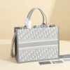 a1720369072772_1051 This book tote handbag was designed by Maria Grazia Chiuri, Creative Director of Dior Women's Wear