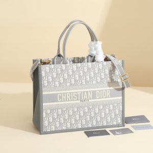 a1720369072793_8408 This book tote handbag was designed by Maria Grazia Chiuri, Creative Director of Dior Women's Wear