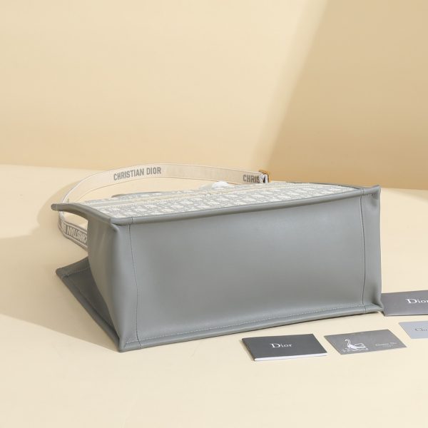 a1720369074189_7505 This book tote handbag was designed by Maria Grazia Chiuri, Creative Director of Dior Women's Wear