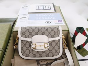 The GG horseclip 1955 series mini handbag adds a mix and match style to this retro style collection