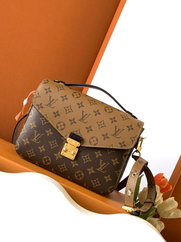 i1702360833_3568_0 Pochette M é tis handbag