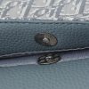 This small saddle messenger bag features a flip design, exquisite and stylish. Crafted with deep grey Oblique printed fabric