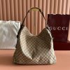 The Gucci Beatrix handbag collection is crafted with black cowhide material and adorned with iconic horseneck buckle details on the shoulder strap