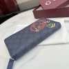 i1769849507643_2824_0_9 Interlocking double G and stirrup prints embellish various small leather items, showcasing festive colors. This pattern is eye-catching and embellished on this fully zippered wallet made of soft GG Supreme
