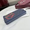 i1769849525794_2913_0_3 Interlocking double G and stirrup prints embellish various small leather items, showcasing festive colors. This pattern is eye-catching and embellished on this fully zippered wallet made of soft GG Supreme
